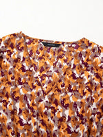 Abstract Print V Neck Smocked Babydoll Blouse