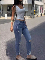 High-Waisted Distressed Skinny Jeans
