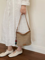 Straw Crossbody Bag with Leather Trim and Tassel Charm