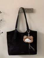 Solid Color Handbag with Plush Charm