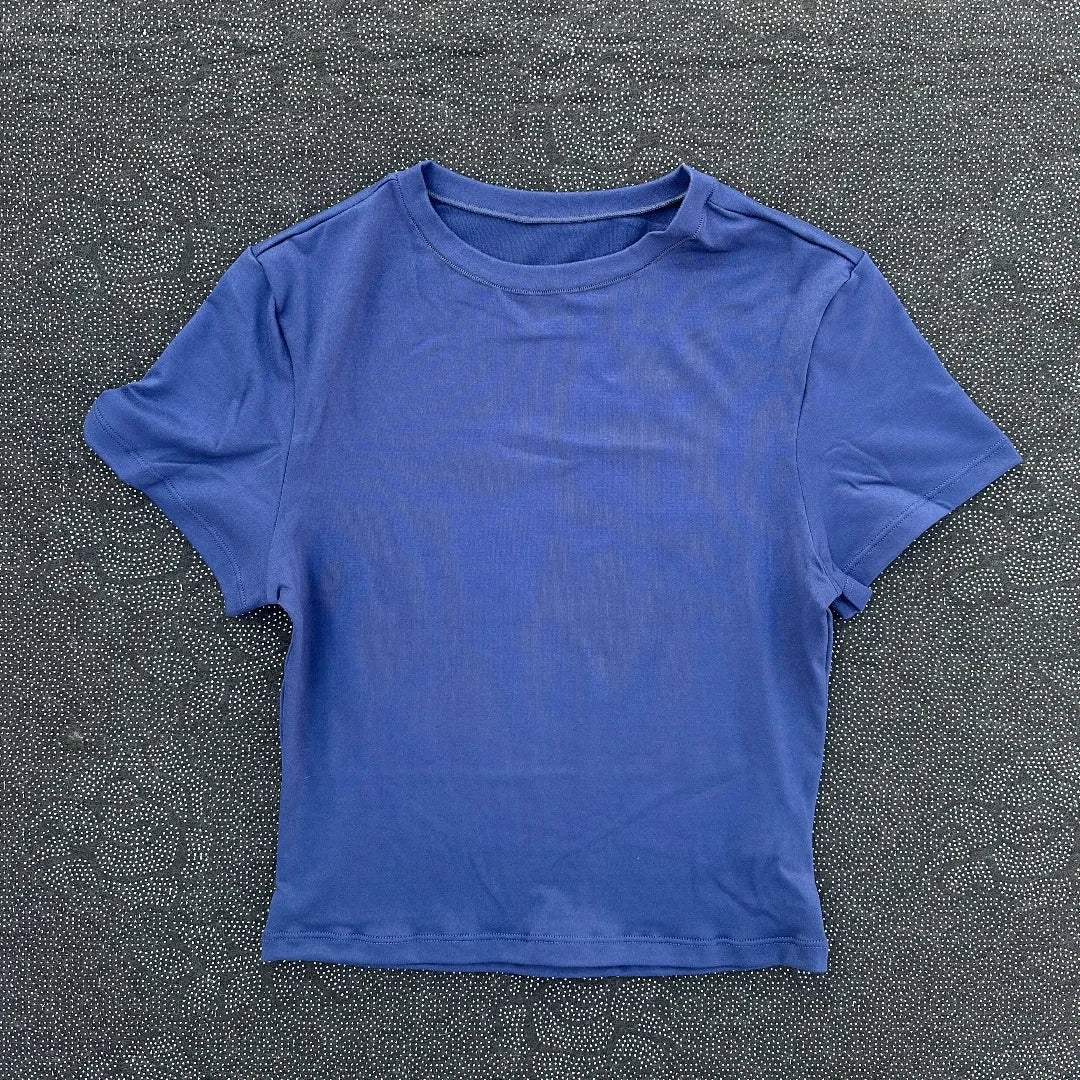 Solid color fitness women's soft breathable yoga short-sleeved comprehensive training tight T-shirt with exposed belly button