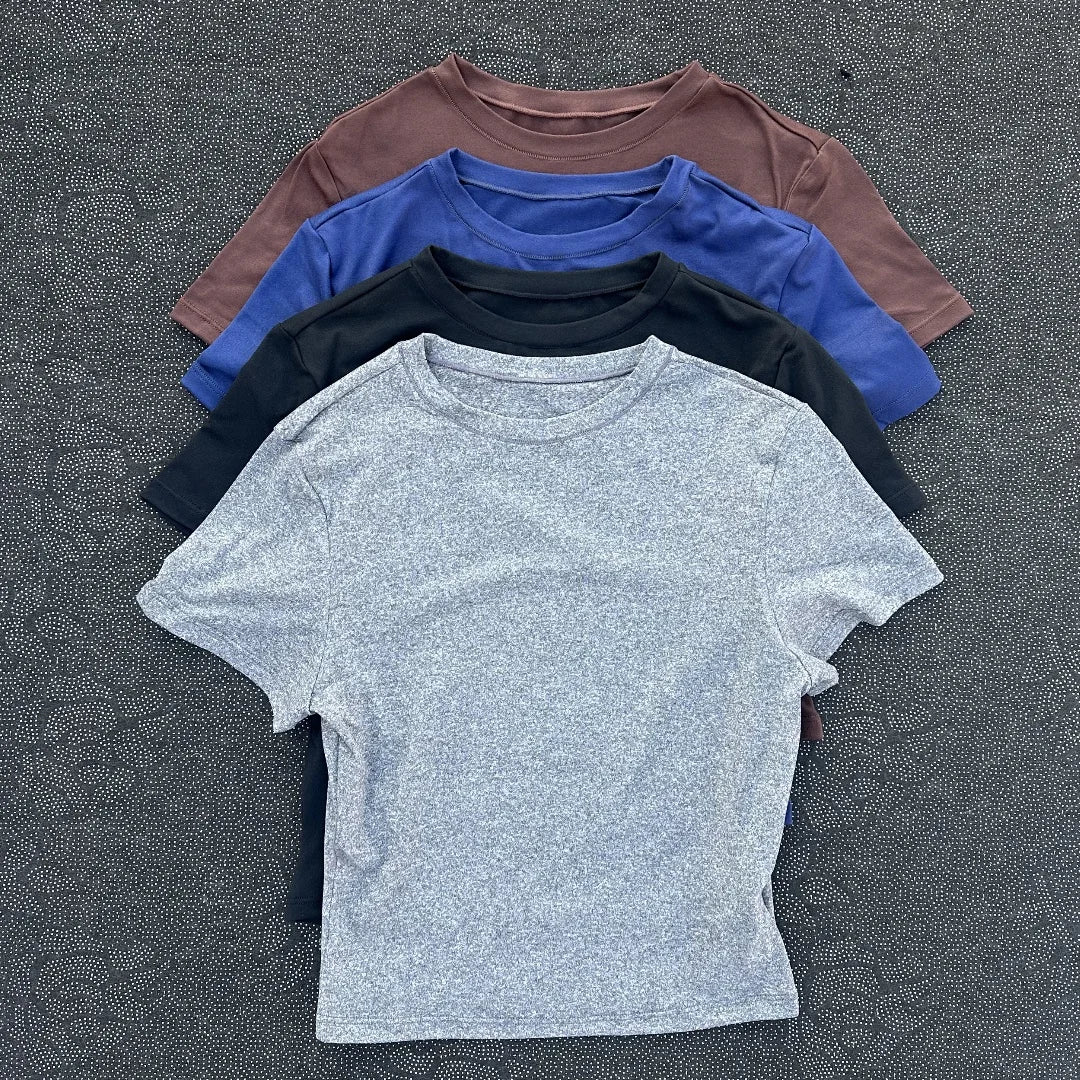 Solid color fitness women's soft breathable yoga short-sleeved comprehensive training tight T-shirt with exposed belly button
