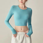 Women's long sleeved yoga suit sports top, high-end tight fitting hollow back fixed chest cushion