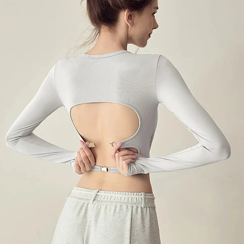 Women's long sleeved yoga suit sports top, high-end tight fitting hollow back fixed chest cushion