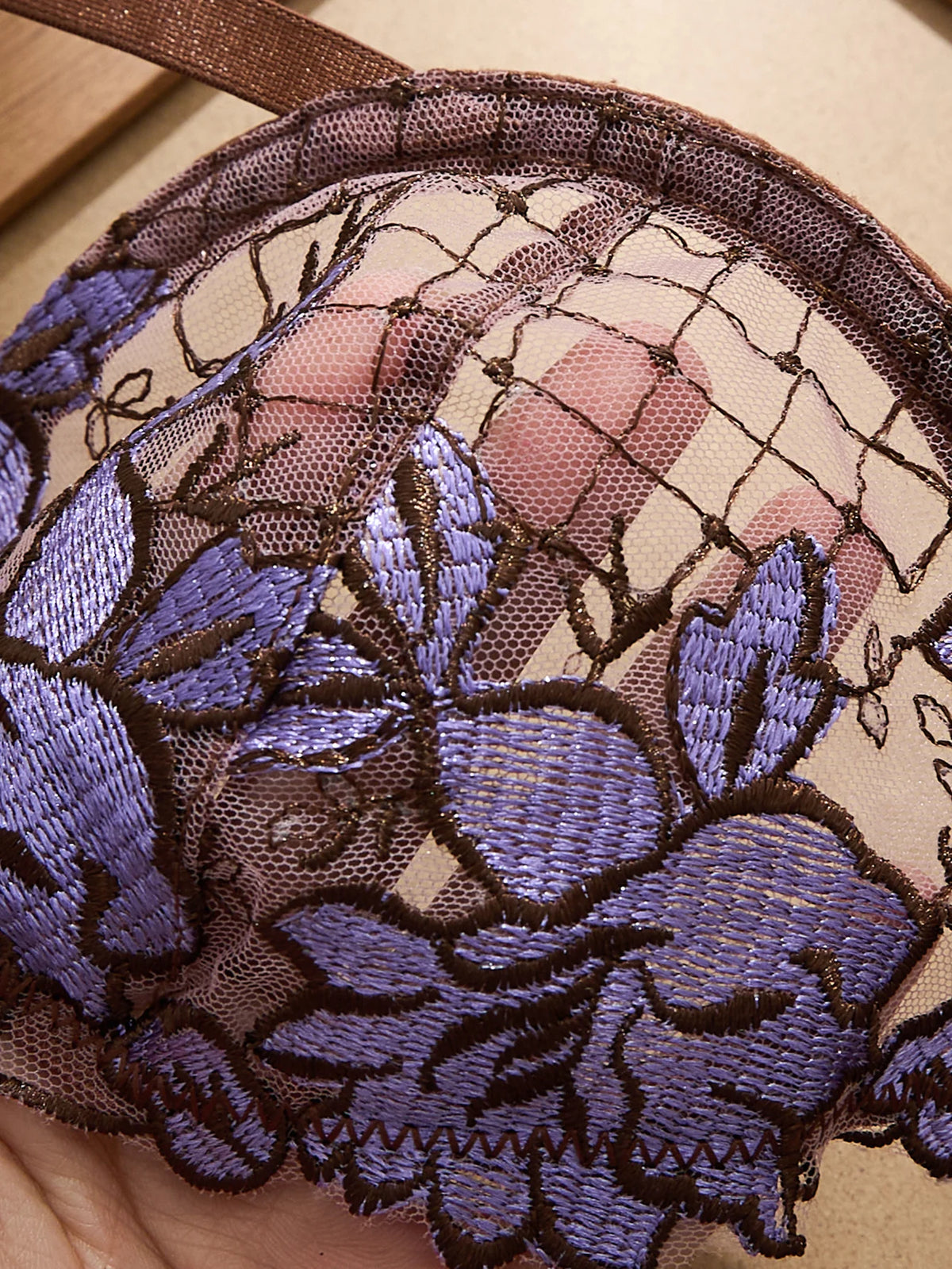 A limited edition brown and purple lace lingerie set with rose embroidery, see-through netting bra, and tie-up thong ZA825200