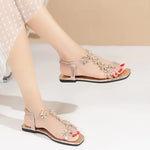 A pair of women's square-toe flat sandals, stylish silver sandals adorned with floral decorations 2026