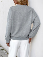 Perfee Cutout Pearl Round Neck Long Sleeve Sweatshirt