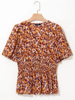 Abstract Print V Neck Smocked Babydoll Blouse