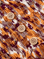 Abstract Print V Neck Smocked Babydoll Blouse