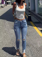 High-Waisted Distressed Skinny Jeans