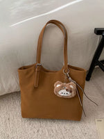 Solid Color Handbag with Plush Charm