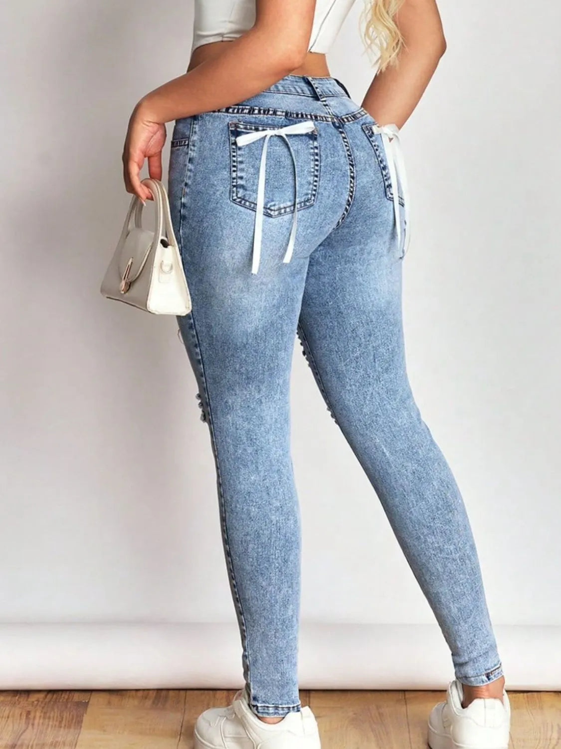 Distressed Skinny Jeans with Bow Back - Ladyez