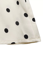 Polka Dot Sleeveless Peplum Blouse