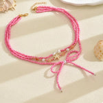 Beaded Three-Layered Necklace with Bow and Starfish Charms