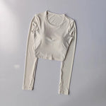Women's long sleeved yoga suit sports top, high-end tight fitting hollow back fixed chest cushion