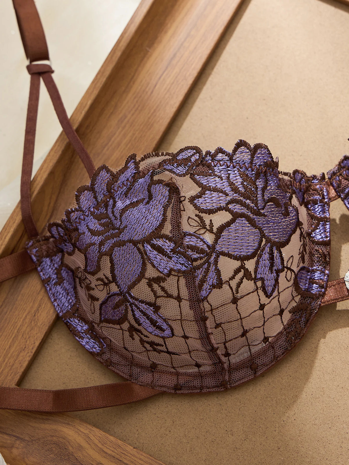 A limited edition brown and purple lace lingerie set with rose embroidery, see-through netting bra, and tie-up thong ZA825200