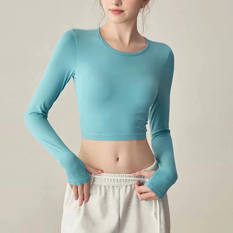 Women's long sleeved yoga suit sports top, high-end tight fitting hollow back fixed chest cushion
