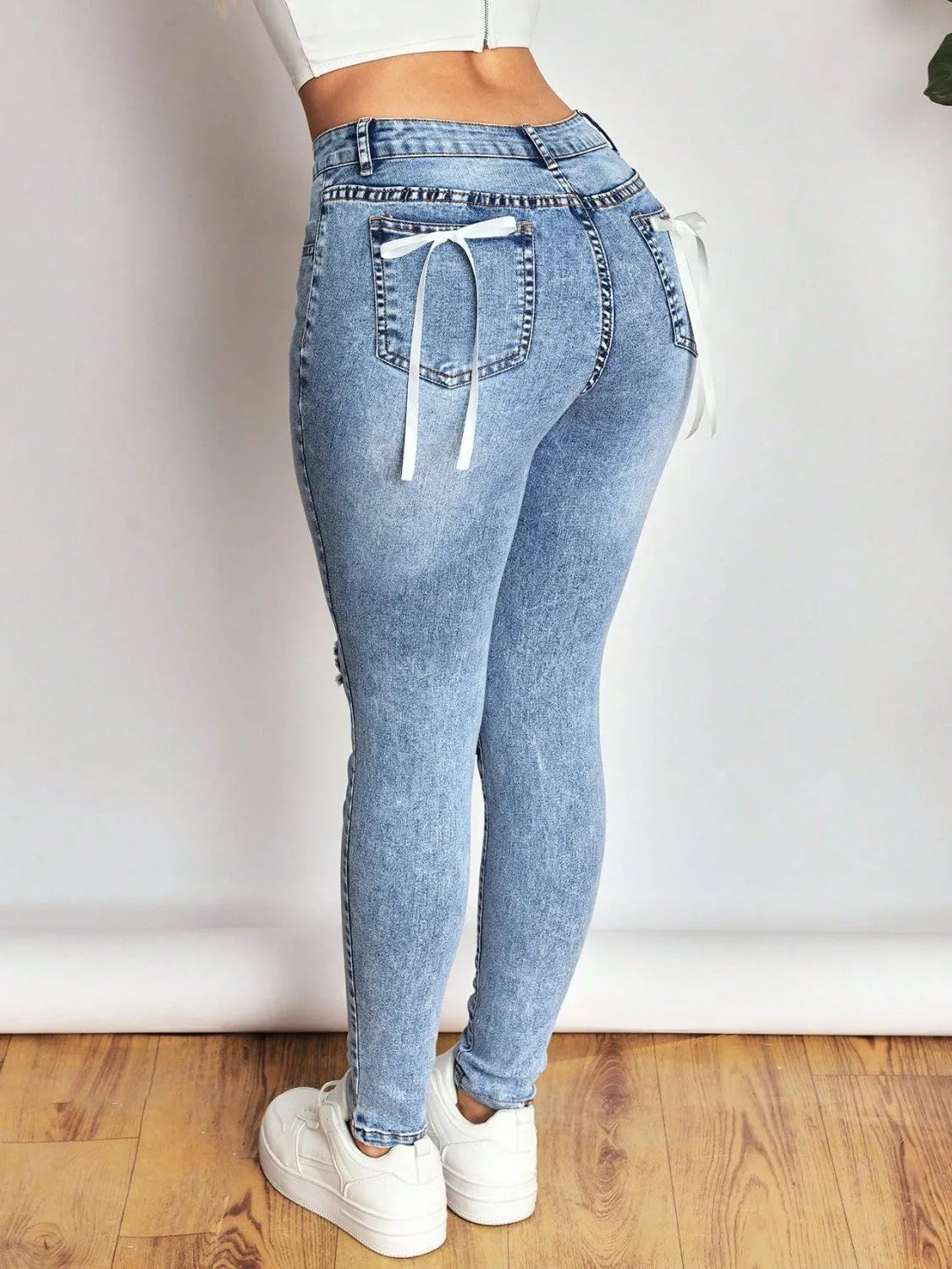 Distressed Skinny Jeans with Bow Back - Ladyez