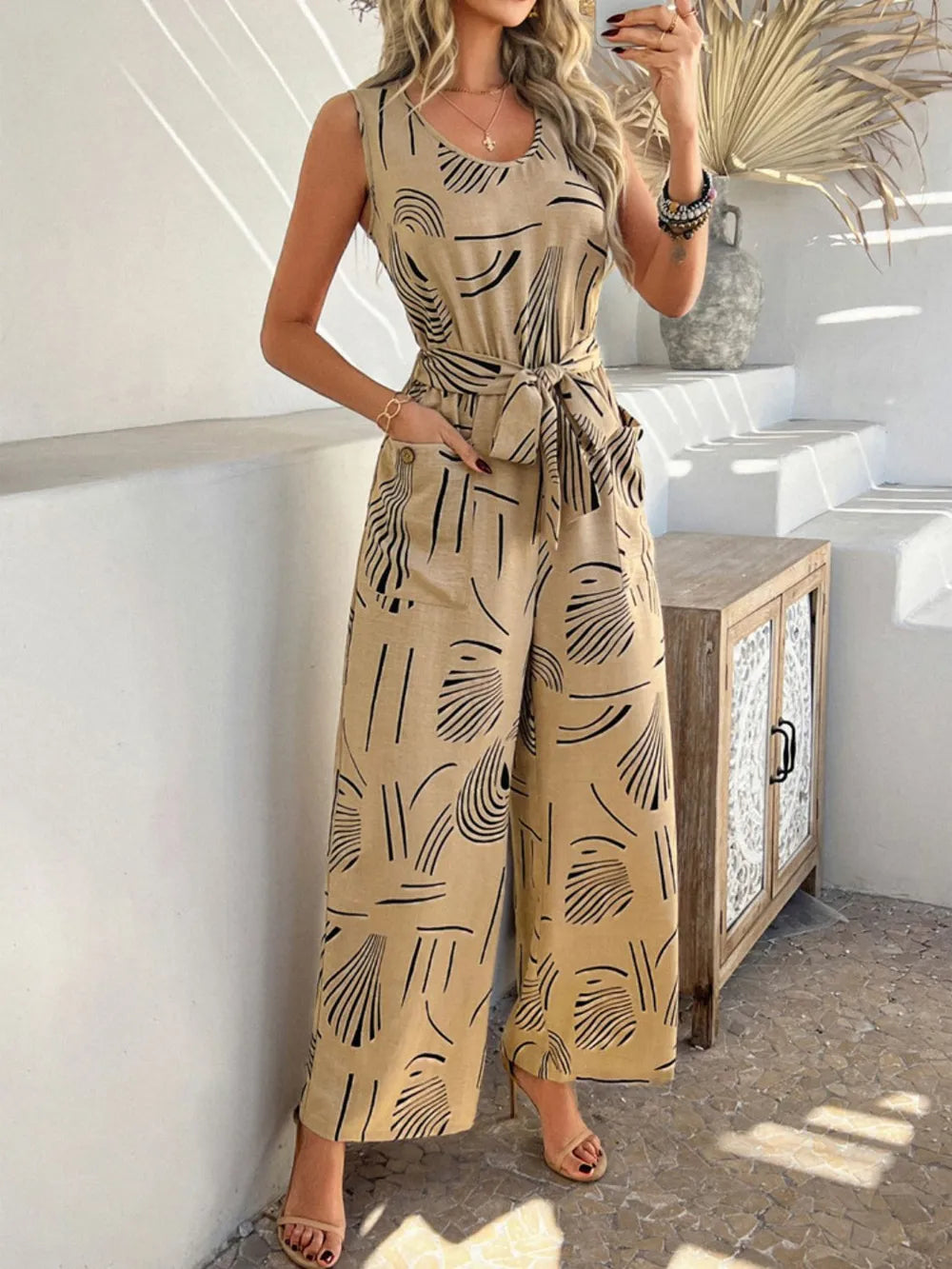 Devine Printed Round Neck Sleeveless Tie Waist Jumpsuit