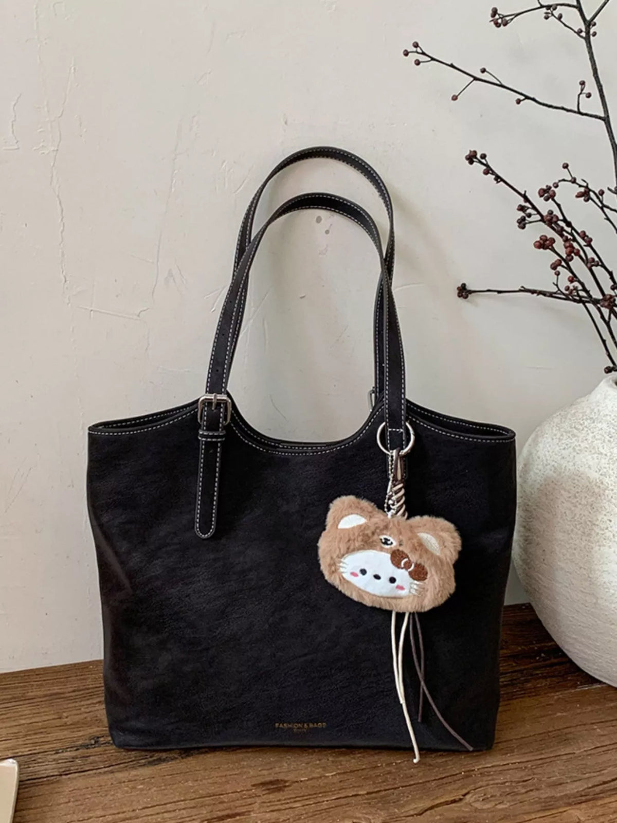 Solid Color Handbag with Plush Charm