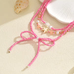 Beaded Three-Layered Necklace with Bow and Starfish Charms