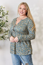 Heimish Full Size Floral Half Button Long Sleeve Blouse - Ladyez