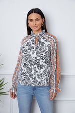 Tassel Tie Neck Printed Smocked Long Sleeve Blouse - Ladyez
