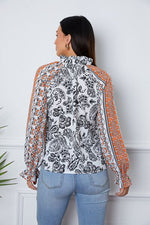 Tassel Tie Neck Printed Smocked Long Sleeve Blouse - Ladyez