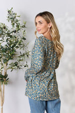 Heimish Full Size Floral Half Button Long Sleeve Blouse - Ladyez